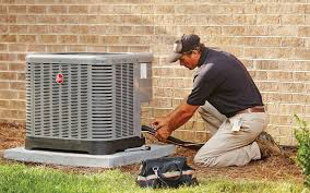 Technician repairing AC