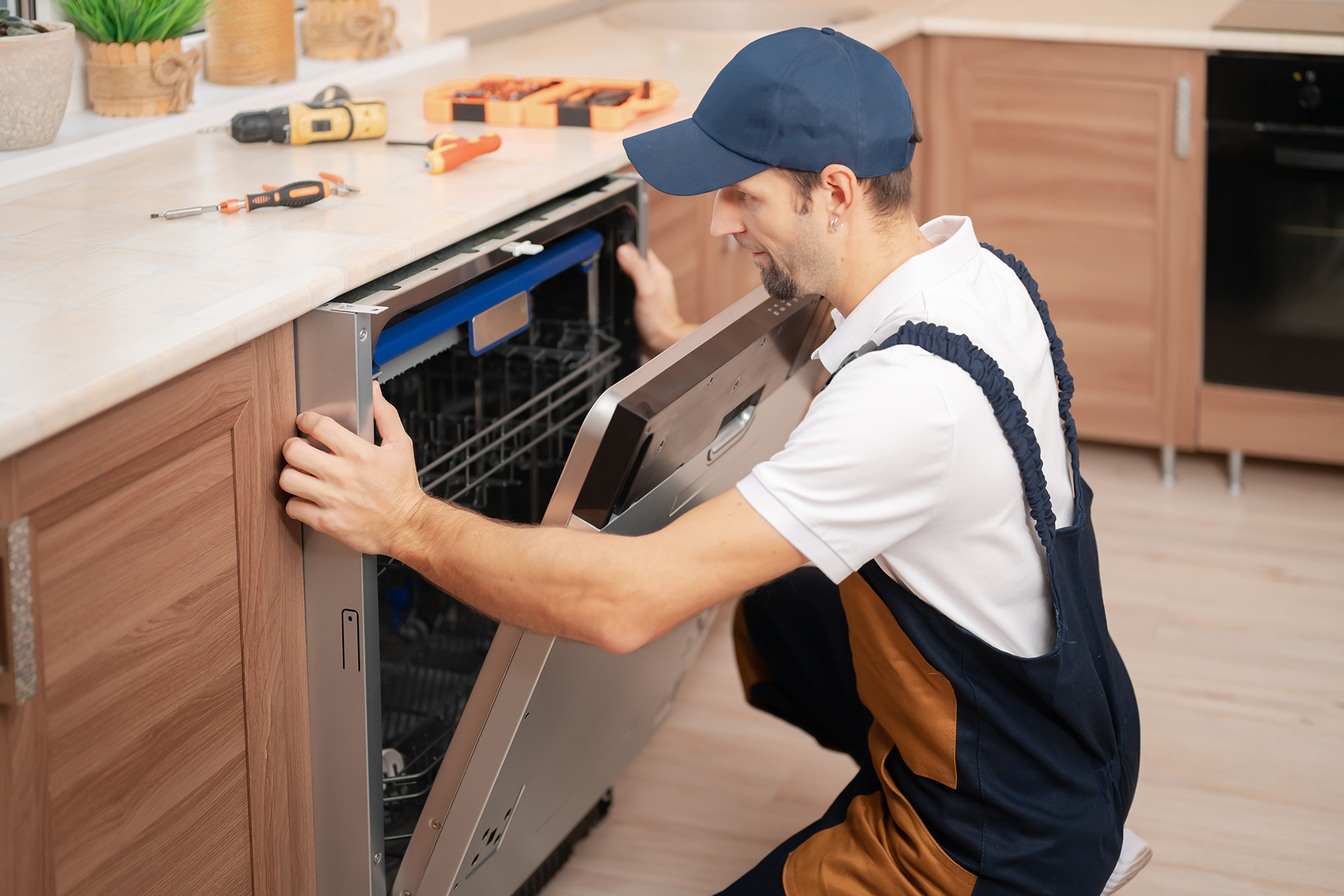 Technician repairing oven