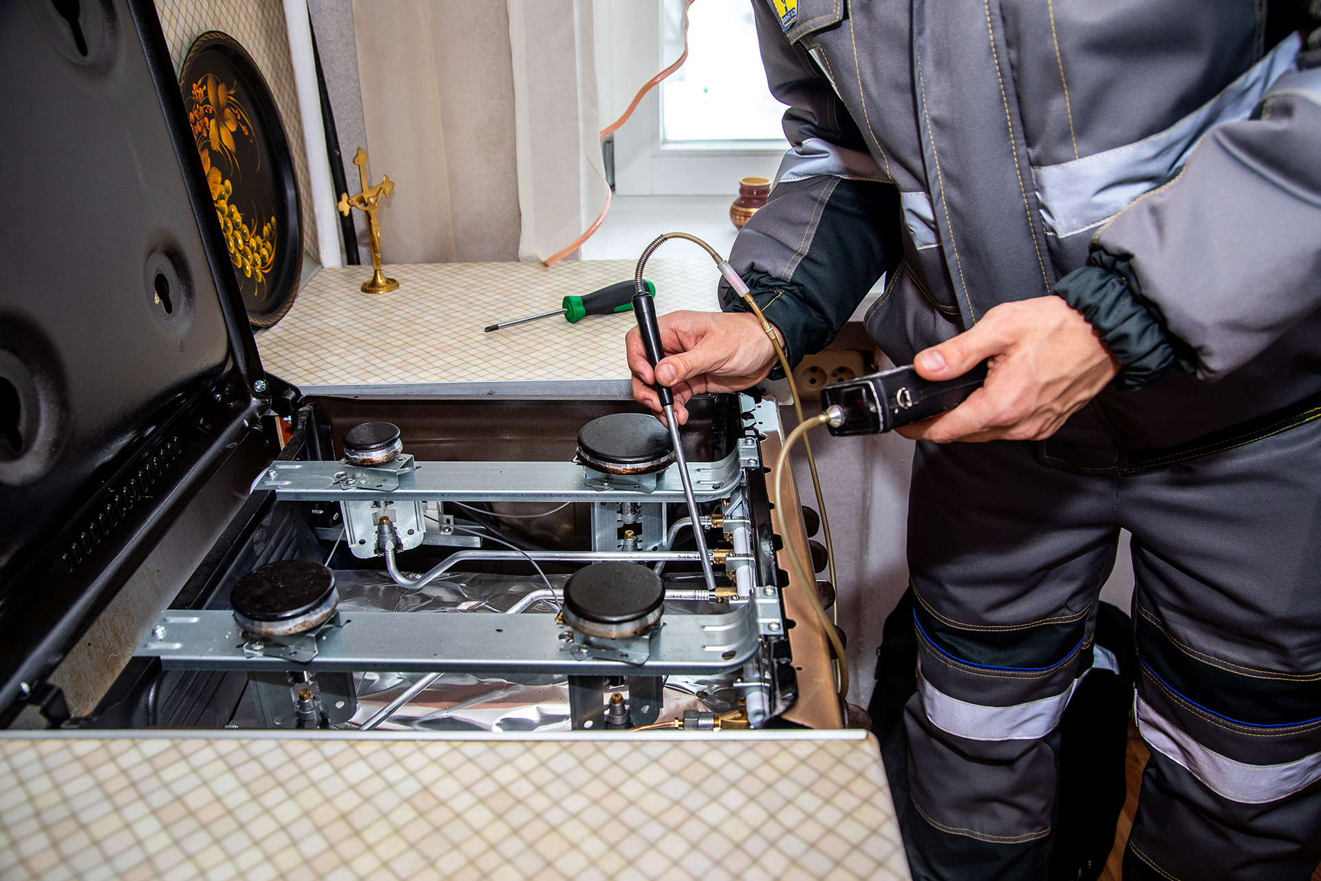 Technician repairing stove
